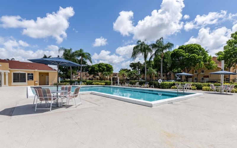 a pool with chairs around it